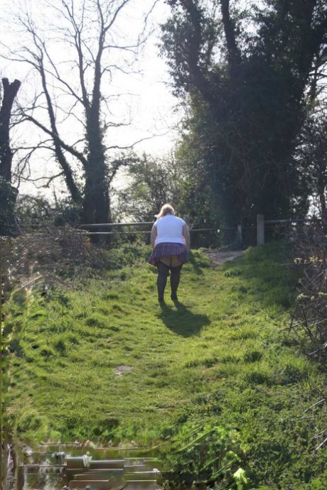 Overweight: Blonde Lexie Cummings bares herself by her locks on a canal system.