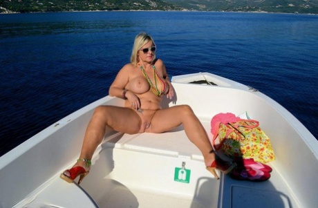 With her busy blonde face in the spotlight, Chrissy is gliding through her thick nude body while flying a speedboat.