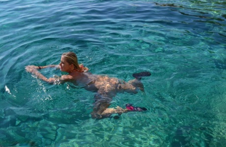 Crumpled: Busy blonde Chrissy takes off in her speedboat, naked, to bask in the sun.