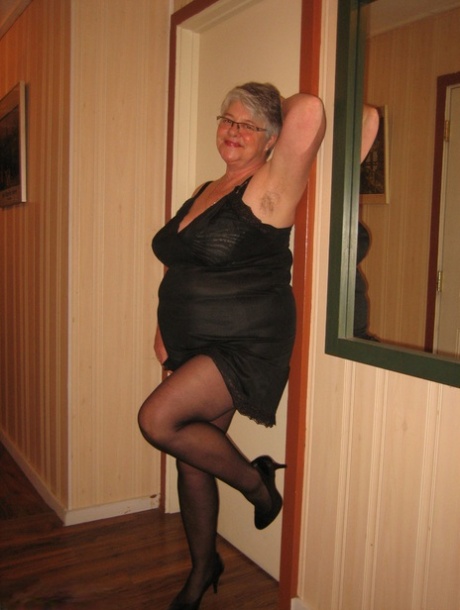 With her pantyhose removed, the Chubby Granny Girdle Goddess exposes herself.