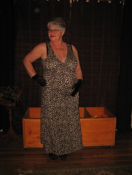 The silver-haired granny girdle Goddess exposes herself in black gloves and stockings.