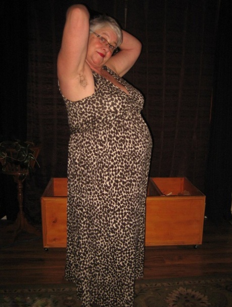 Silver-haired granny girdle Goddess exposes herself in black gloves and stockings.