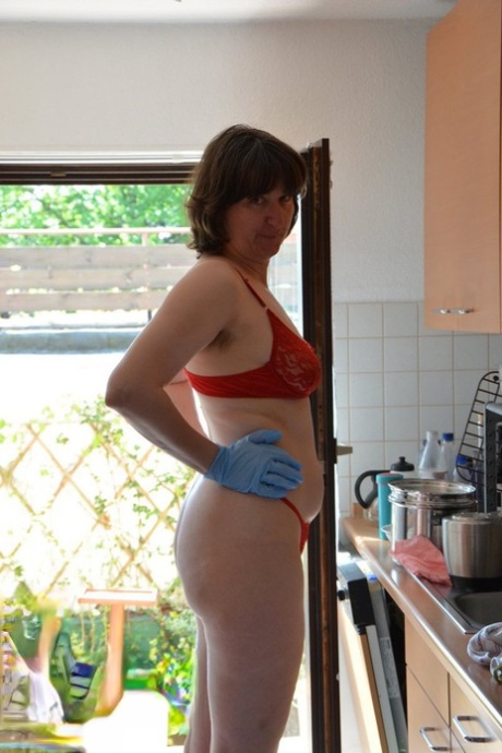 Leggy Woman Does Her Housework In Bra And Thong With Matching Heels