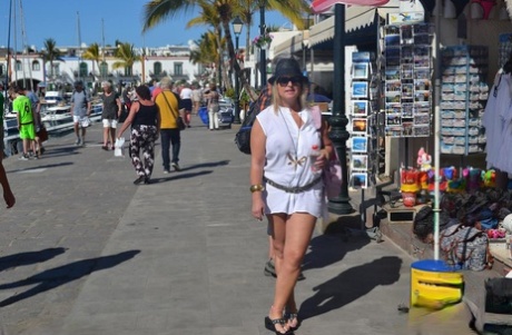 No costume, just a stroll along the beach as an amateur named BBW Nude Chrissy (L) walks.