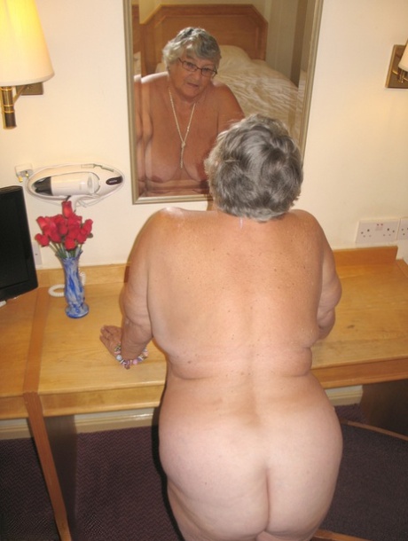 Fat British woman, Grandma Libby (pictured), disrobes in a hotel room.