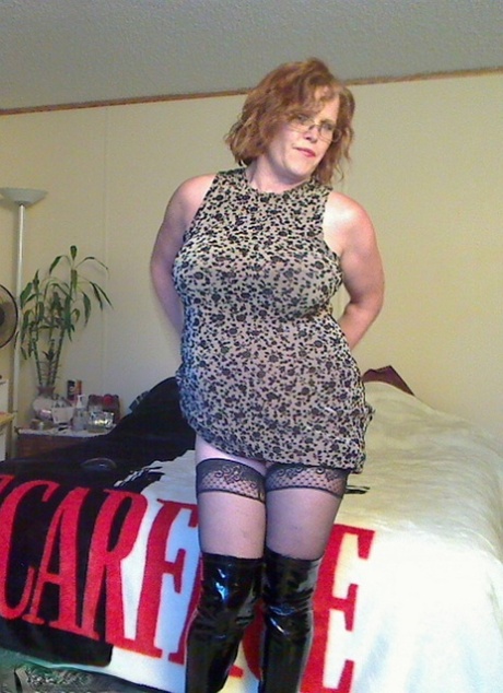 Misha MILF, a redhead from the middle age group, loses her large tits before trying anal dildoing.