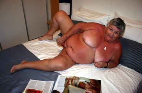 Grandma Libby, an obese British woman, engages in self-pleasure while reading a girly magazine.