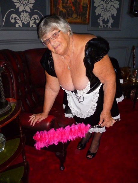 Grandmother Libby, the overweight maid, switches off her uniform and poses in nude in stockings.