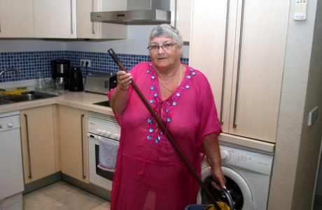 Grandma Libby, a fat UK woman, is seen completely nude while cleaning her kitchen.