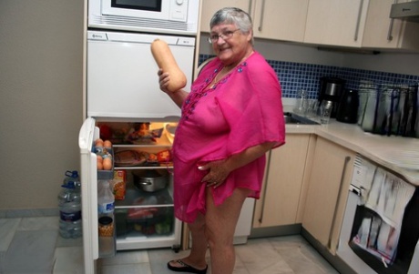 As she cleans her kitchen while being fat UK nan, Grandma Libby is stripped down to her knees and hands in the nude.
