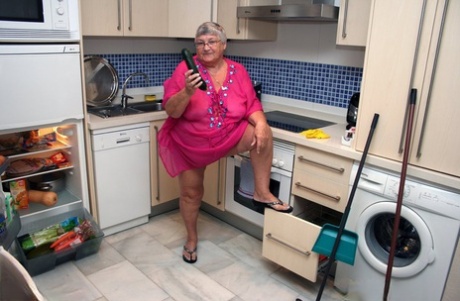 Cleaning out the kitchen of her fat British relative, Grandma Libby is seen in a completely naked state.