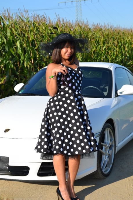 Asian Amateur Gets Naked On Top Of A Car While Wearing A Big Hat