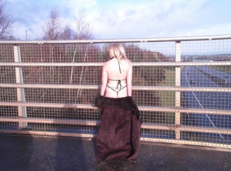 In an overpass, Barby Slut, an older performer with a short fuse, flashes on a pavement.