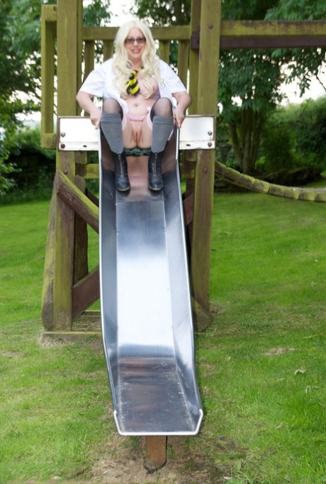 Barby Slut, a schoolgirl from the UK, exposes herself on a playground.