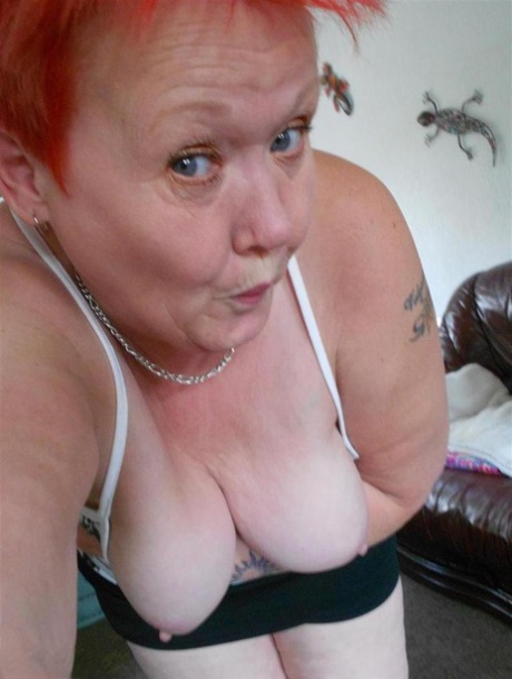 Taking selfies with the old Valgasmic Exposedabres' red hair, she displays her tits and twats.