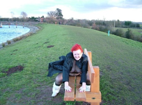 The Redhead Valgasmic Exposed enjoys a playtime in the park wearing only one of her crotchless stocking.