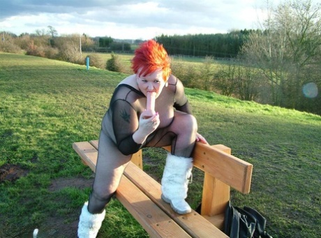 A park playground is where Redhead Valgasmic Exposed plays with a toy in a non-slip cotton ball.