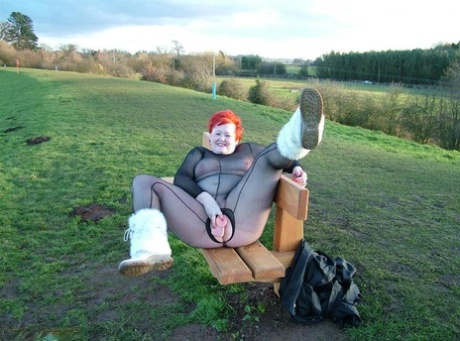 Playing in a park with his toy, Redhead Valgasmic Exposed is dressed in an all-seater shirt without a backrest.