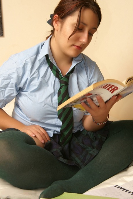 Snuggish schoolgirl Kimberly Scott is engaging in reading smut and masturbating while having fun.