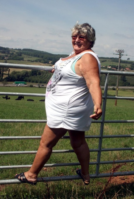 The older woman from Britain, known as Grandma Libby, exposes herself by the side of a field of cattle.