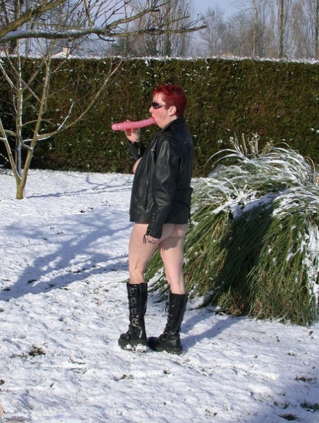 A noisy, full-grown adult MaryBitch who is quite busy gets dirty and masturbates in the snow.