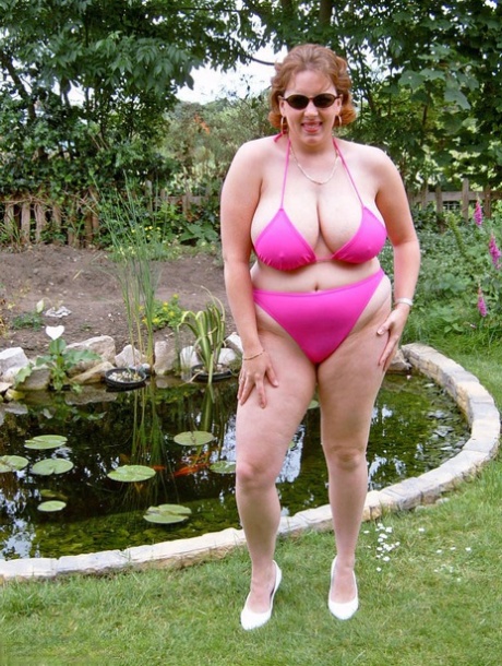 Blinkers: Brazen mature fatty named Curvy Claire gets messy in the back yard and has her face tattooed on a bikini to show off.
