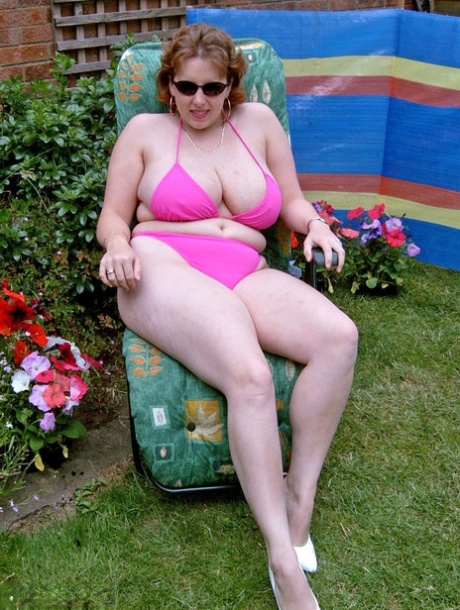 Curvy Claire, the courageous and savage woman, removes her bikini from the backyard to engage in finger-pointing.