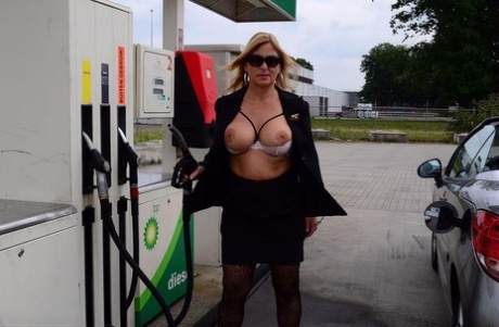 Older blonde Nude Chrissy exposes herself while filling up at a petrol station free hd photo #4