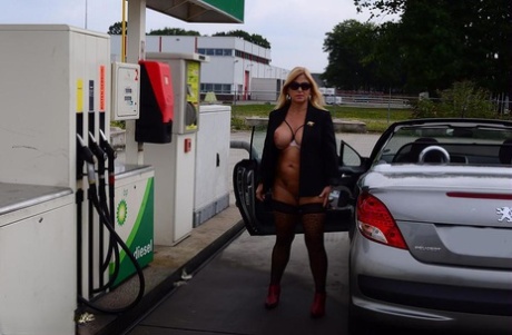 Older blonde Nude Chrissy exposes herself while filling up at a petrol station #16