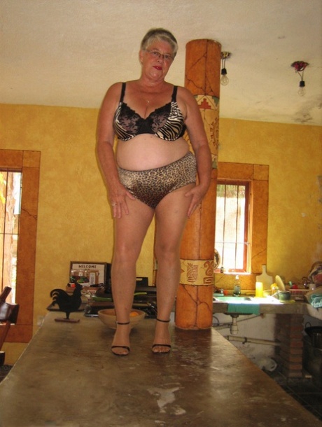 To strip naked, fat oma Girdle Goddess strips strip strip to the kitchen island while wearing tan pantyhose.