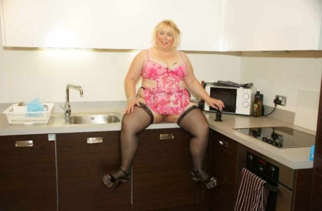 With a suction dildigree on her counter, Lexie Cummings, a fat UK blonde, masturbates.