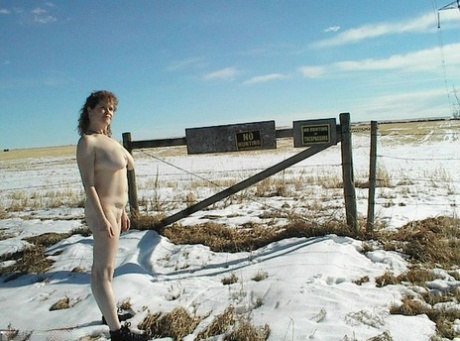 Despite being a mature amateur, Misha MILF remains unclothed on snowy terrain.