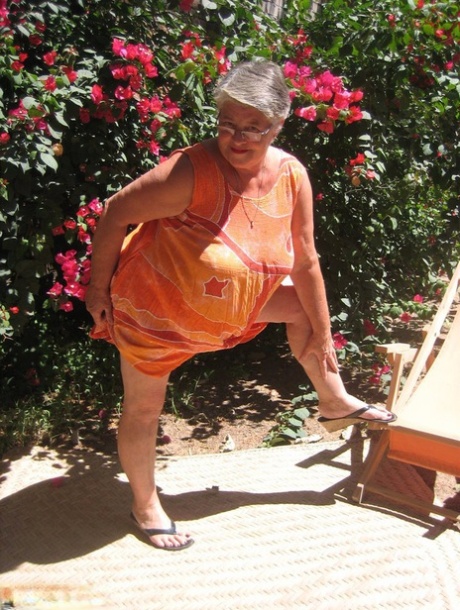 During the summer months, The Obsese Granny Girdle Goddess exposes herself to her sandals on their garden terrace.