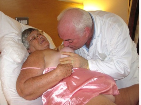 The elderly mother, Libby, engages in sexual activities with her deceased doctor on the bedside.