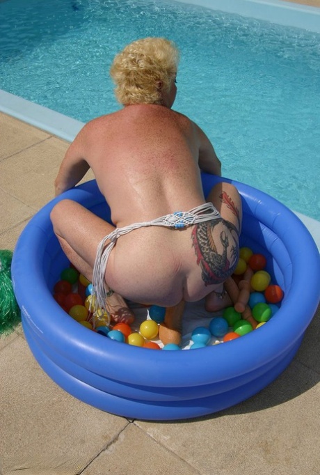 During her snatching excursion, Mary Bitch, who is now fully grown up, engages in cuddling alongside another swimming pool.