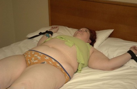 Her attire vanishes as we fasten BBW Inkedoracle to her bed, who is an amateur.