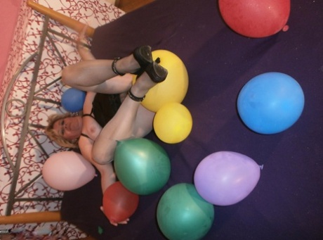 At one point Caro was so full that she tried to smash the balloons up on top of her bed and looks like she's older and blonde, and she has