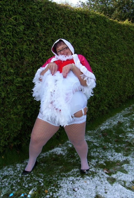 During Christmas, Warm Sweet Honey, a fat lady, participates in outdoor lesbian sex.