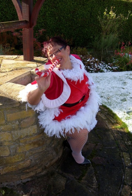 A fat sex worker named Warm Sweet Honey participates in outdoor lesbian sex during the Christmas season.