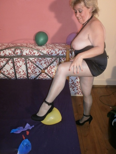 Old Woman Caro Bares Her Tits In Pantyhose Amid Balloons On Her Bed