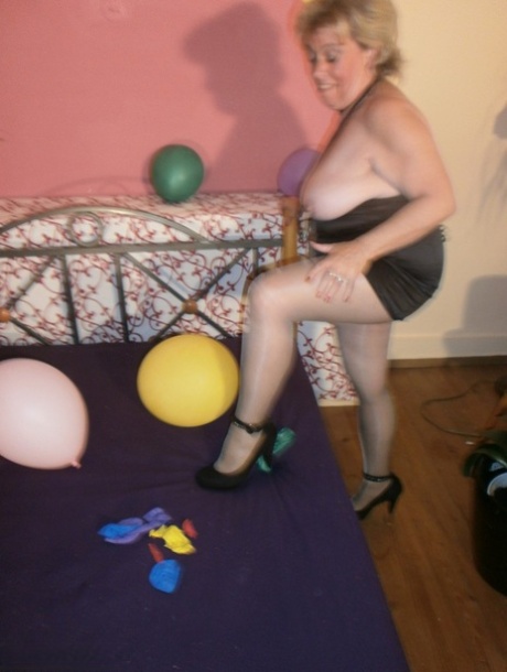At night, Caro exposes her breast tissue in pantyhose and displays balloons on the bed of an elderly woman.