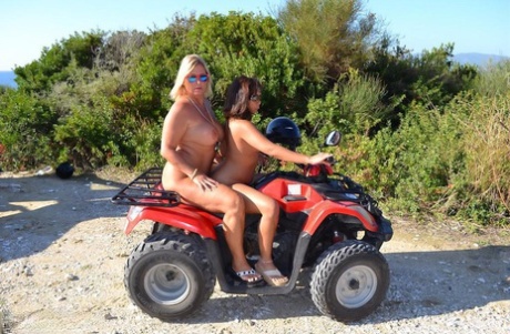 The nude photo features blonde-haired Chrissy and her girlfriend driving around in the back of a car.