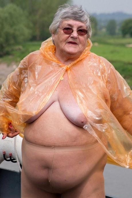 A transparent raincoat is removed by Grandma Libby, an obese British amateur who is overweight.