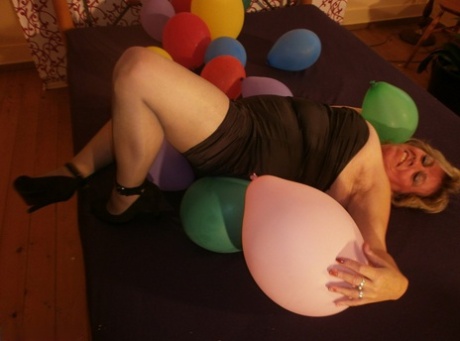 Hot Granny Caro In Shiny Sheer Pantyhose & Heels Crushing Balloons On Her Bed