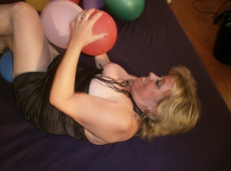 Hot Granny Caro In Shiny Sheer Pantyhose & Heels Crushing Balloons On Her Bed