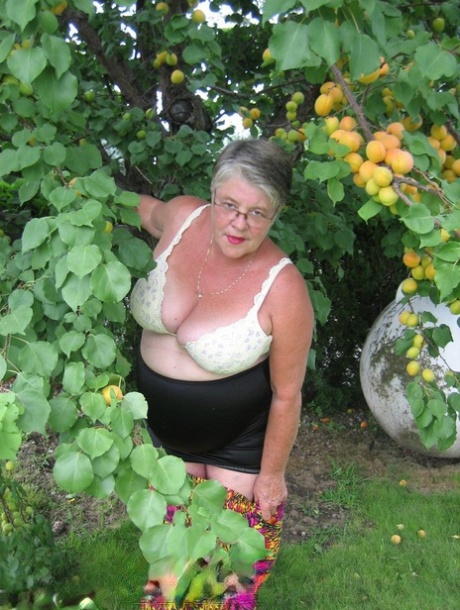 In this story, Fat Granny Girdle Goddess displays her large tits beneath an apple tree.