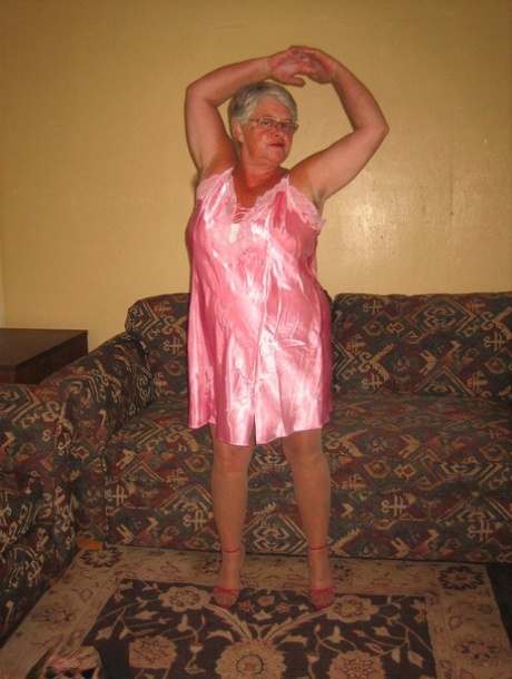 She releases her breasts and pussy from lingerie as an Amateur Granny Girdle Goddess.