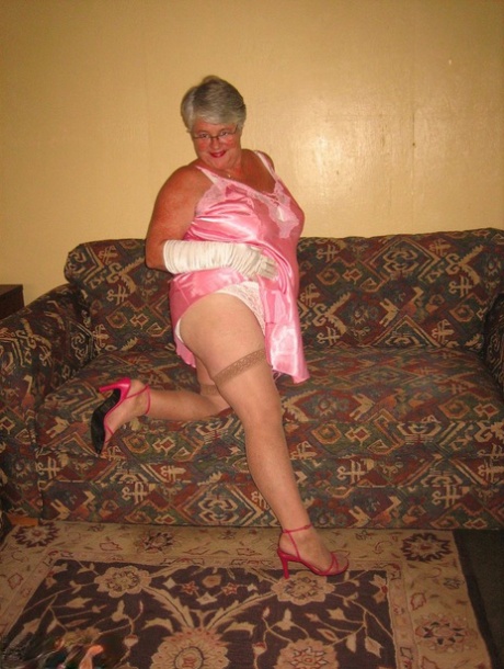 From her lingerie, the Amateur Granny Girdle Goddess releases all of her breasts and pussy.