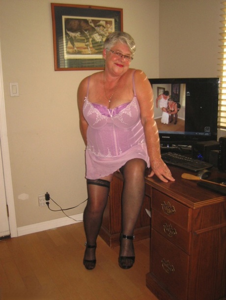 Lingerie: The naked assets of old-fashioned Girdle Goddess is shown naked in her lingerie and nylons.