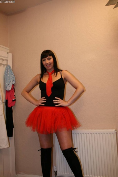 British beauty Tracey Lain wears a red tutu as she takes it in the anus.